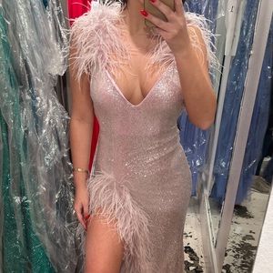 Jovani feather trimmed high slit long gown size 2. Fits size 4-10